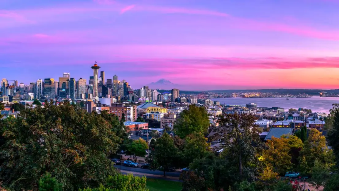 Seattle skyline at sunset with the Space Needle in view.